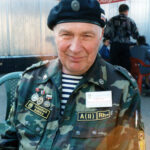 Tour guide Colonel Ozerov in a field uniform and a tank museum insignia